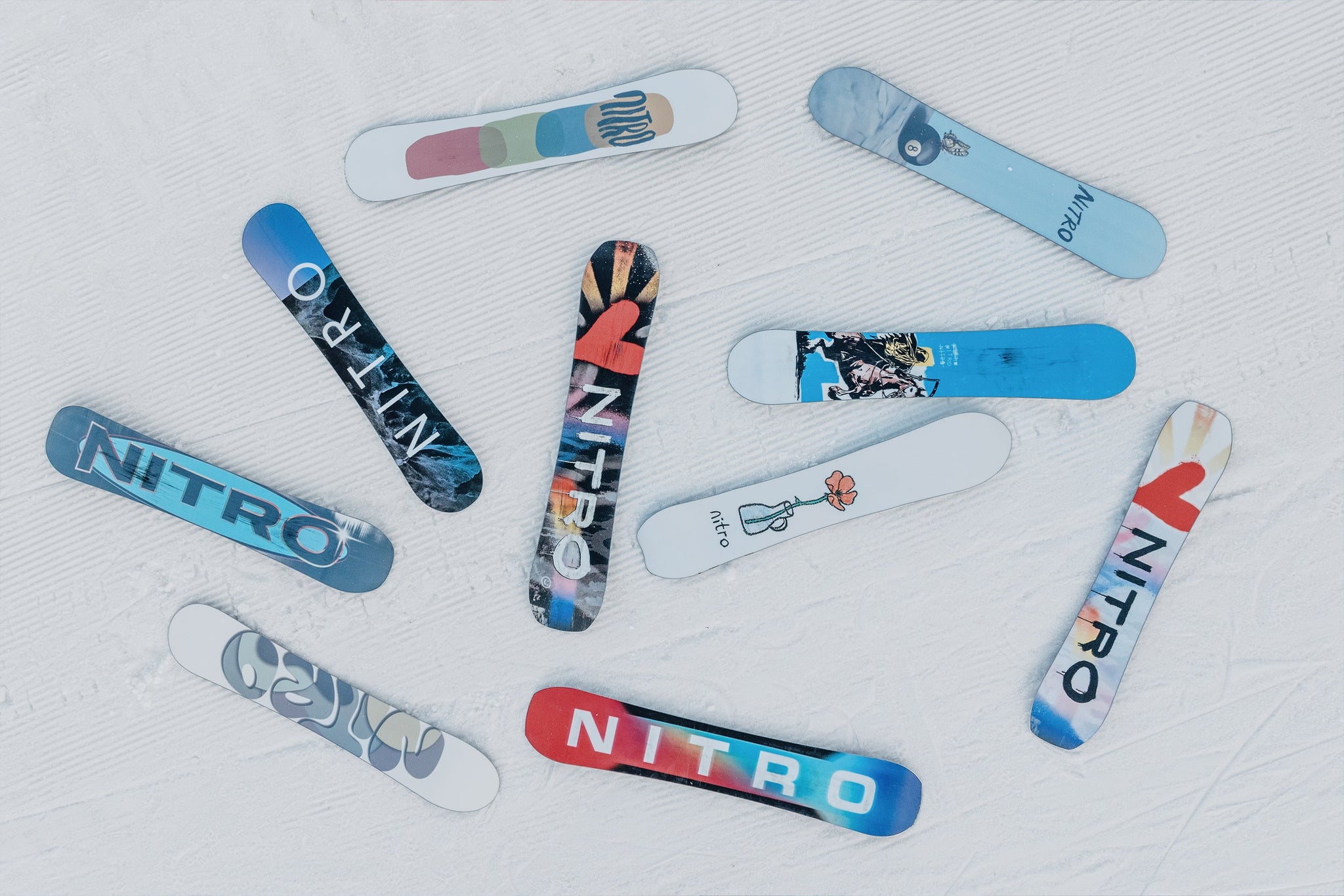 blue and white nitro snowboard Junior's Arial 2026 while the Sintered Speed Formula Base delivers fast glide and great speed Snowboards