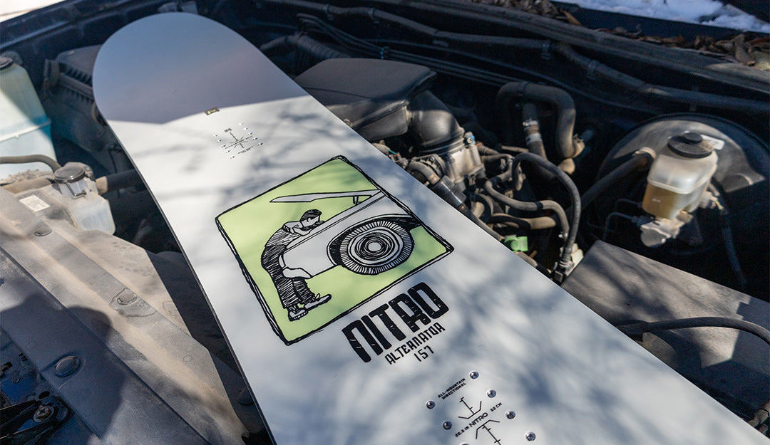 Alternator snowboard lying on a car's engine